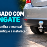 Traseira de carro com engate esférico em capa sobre a conferência do manual e da instalação